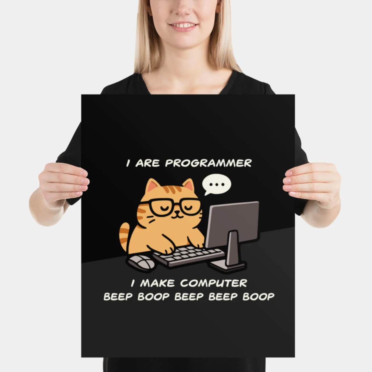 Black I Are Programmer Cat Poster featuring a cute, orange cat wearing glasses and coding on a monitor. The text reads: "I ARE PROGRAMMER. I MAKE COMPUTER BEEP BOOP BEEP BOOP." This is a funny Cat Coding Meme and Developer Poster.
