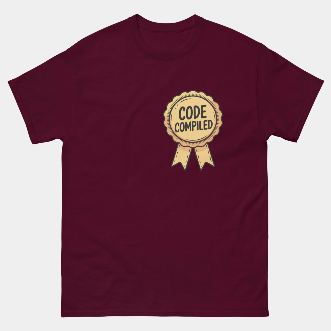 A maroon Software Engineer Tee featuring a gold ribbon badge on the left chest area with the text "CODE COMPILED" inside it. This is a Code Compiled Funny Programmer T-Shirt