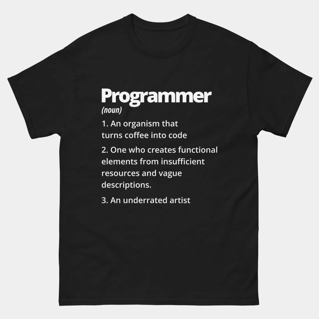 A black Funny Coffee Into Code Graphic Tee with white text showing the dictionary definition of "Programmer" as a coffee-to-code organism and an underrated artist. This is a Funny Software Programmer Definition T-Shirt
