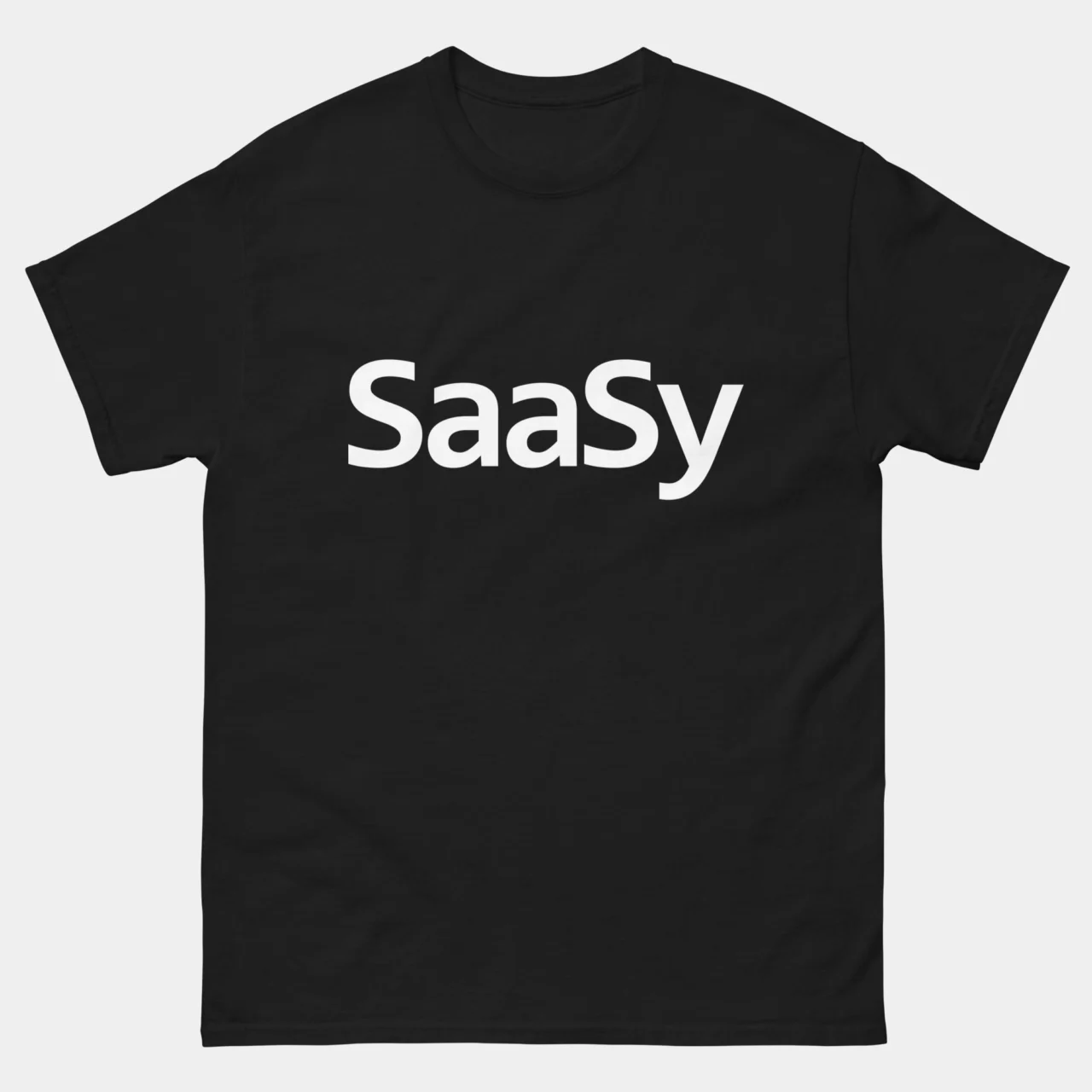 Black minimalist Funny SaaS Developer Shirt with bold white text reading SaaSy, funny software as a service pun graphic tee for SaaS developers founders and product managers