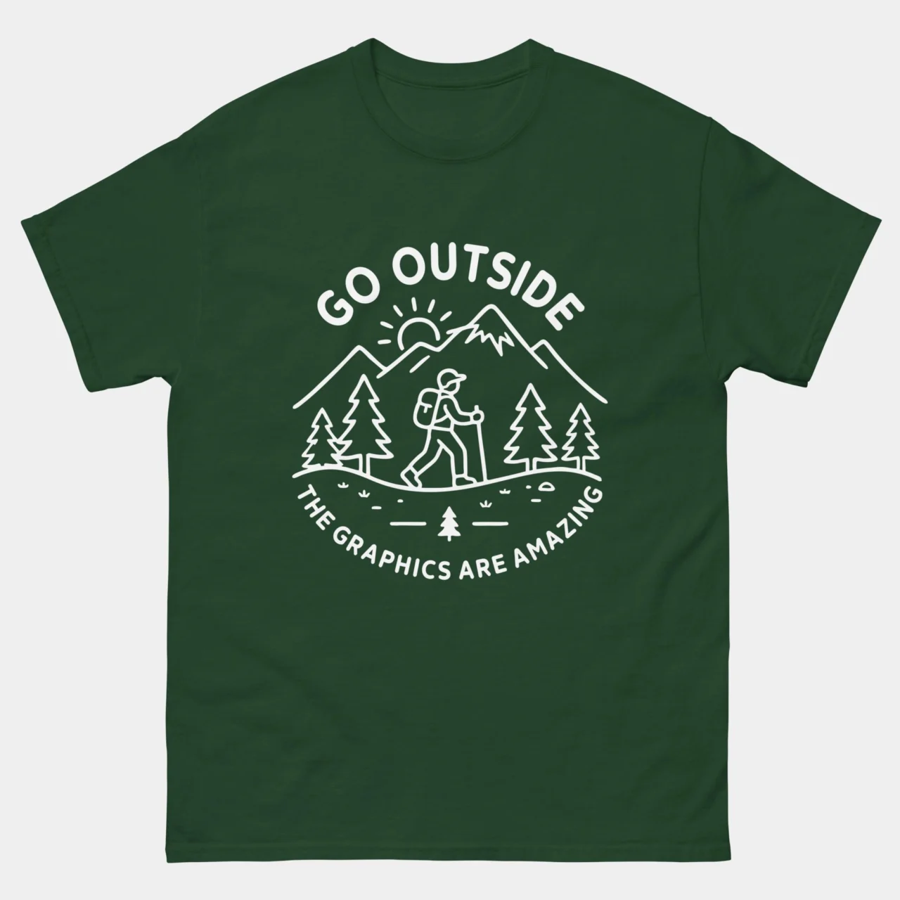 Forest green Go Outside The Graphics Are Amazing Shirt - funny gamer t-shirt featuring white line art of a hiker in mountains with trees and sunshine, with arched text reading Go Outside and curved text reading The Graphics Are Amazing, outdoor gaming humor graphic tee