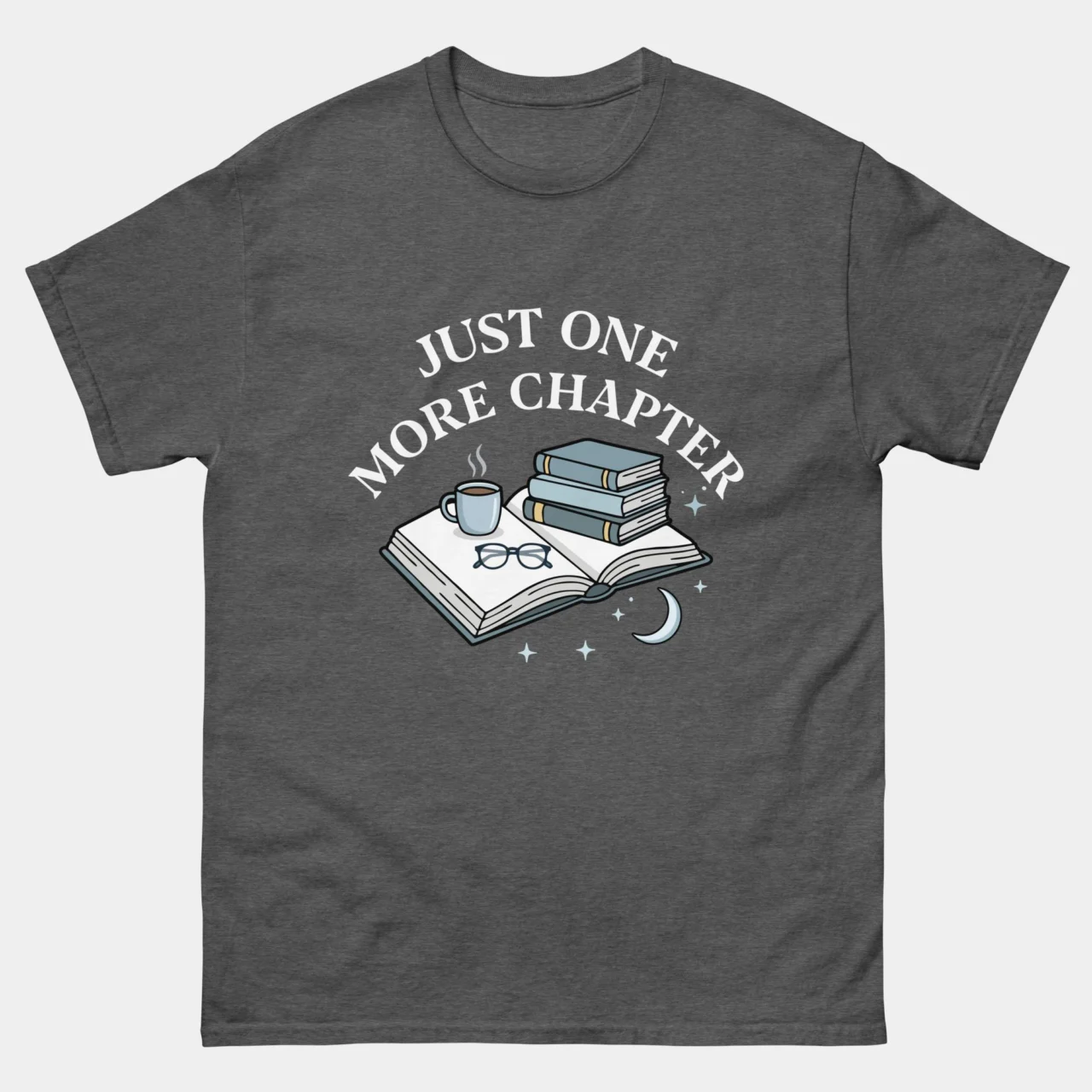 Heather grey cozy Just One More Chapter Book Lover T-Shirt featuring illustrated stacked books, glasses, a coffee mug, moon and stars above arched text reading Just One More Chapter, reading lover graphic tee for book nerds