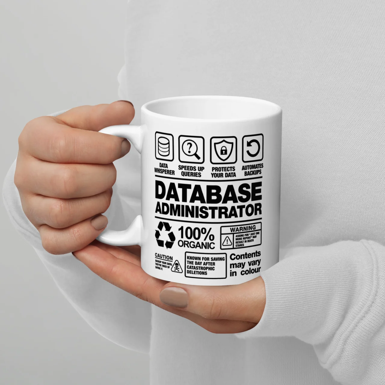White ceramic mug styled like a product warning label reading "Database Administrator, 100% Organic," a Database Administrator Label Funny Job Mug for DBAs