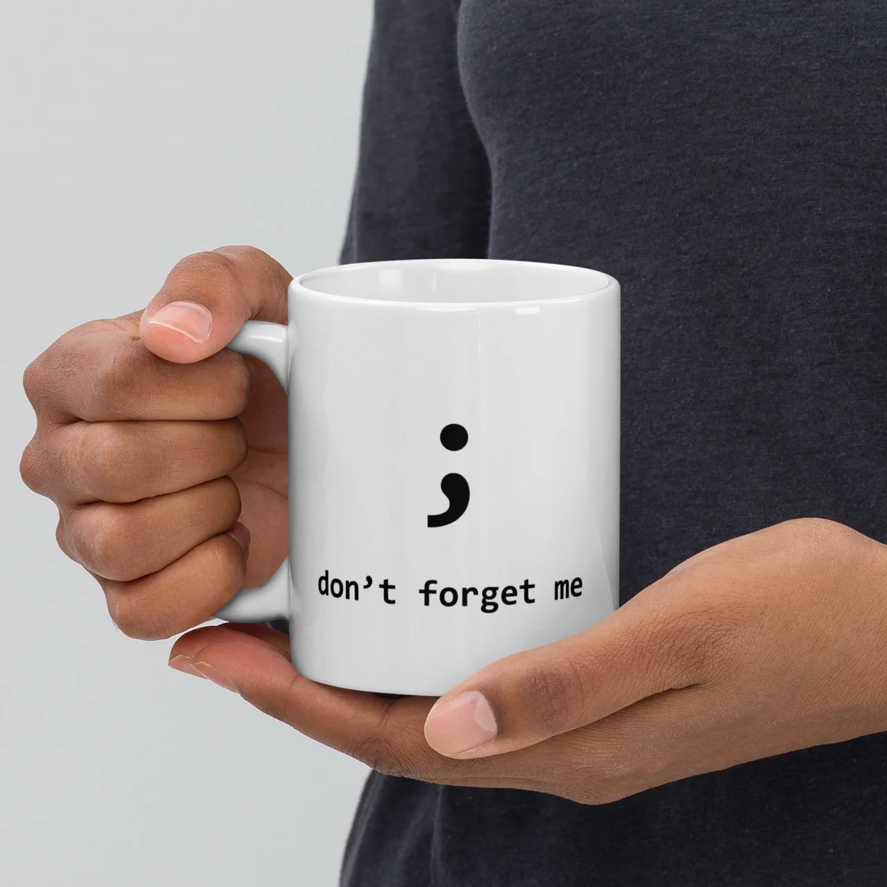 White ceramic mug with a bold semicolon symbol and the text "don't forget me," a funny programmer syntax error coffee mug - Don't Forget Me Semicolon Funny Coding Mug for coders