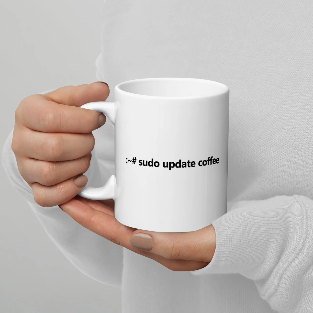 White ceramic mug printed with the Linux terminal command ":~# sudo update coffee" in bold black text, a funny coffee mug for programmers - Sudo Update Coffee Funny Terminal Mug