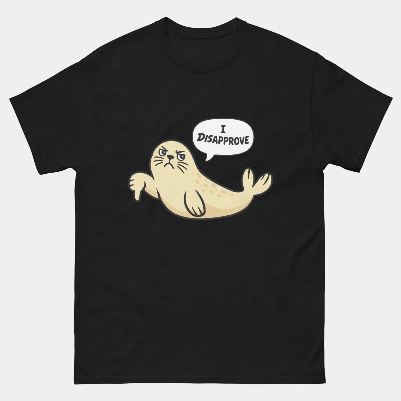Black Seal Of Disapproval Funny T-Shirt with a grumpy cream cartoon seal giving a thumbs down and a speech bubble saying I Disapprove